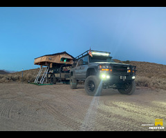 1999 purpose built GMC suburban with M105 custom camp trailer and roof top tent