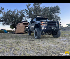 1999 purpose built GMC suburban with M105 custom camp trailer and roof top tent