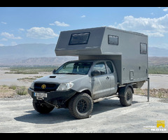 Toyota Hilux with custom cabin, offroad in comfort